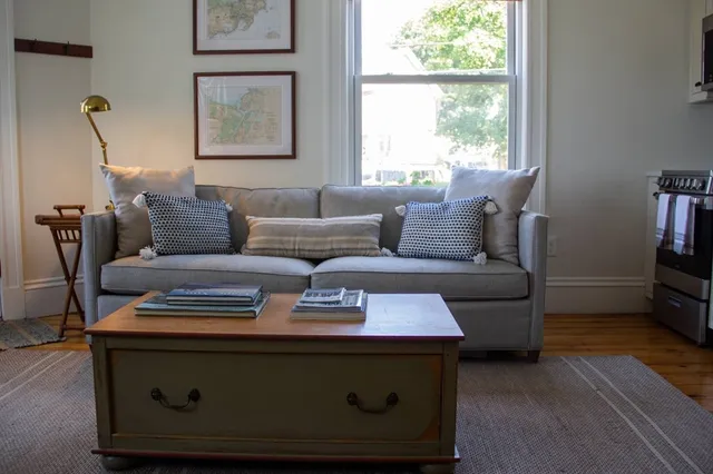 a living room with furniture and a window