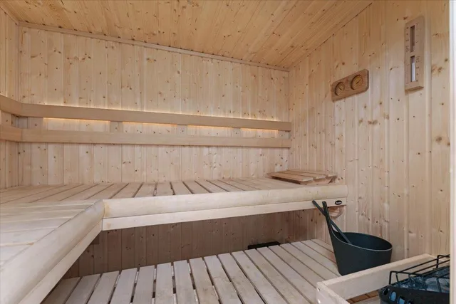 an aerial view of multiple houses with a yard