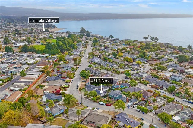 an aerial view of residential building and parking space