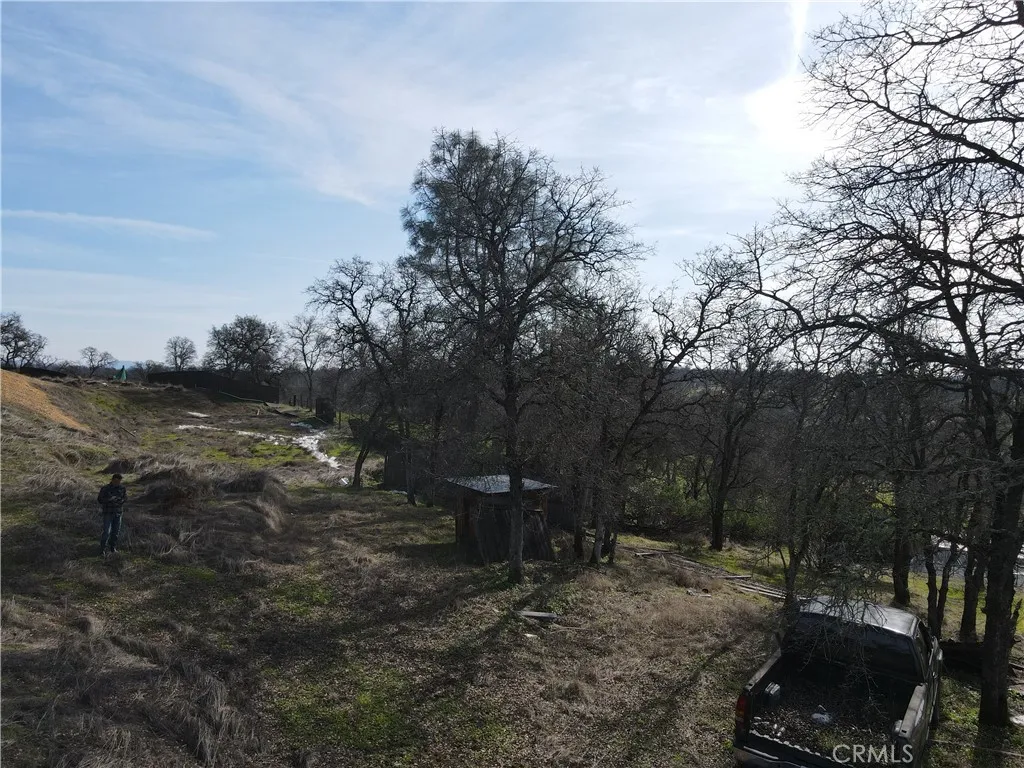 0 Reginald Way Palermo, CA 95968 - Photo 56 of 75 a view of a backyard with table and chairs and wooden fence