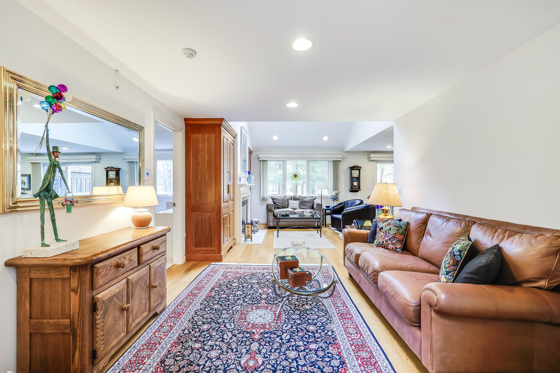 23 Longwood Road Mashpee, MA 02649 - Photo 11 of 66 a living room with furniture fireplace and a rug