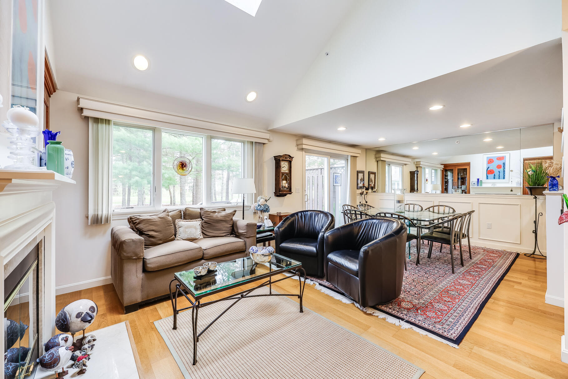 23 Longwood Road Mashpee, MA 02649 - Photo 12 of 66 a living room with furniture fireplace and a table