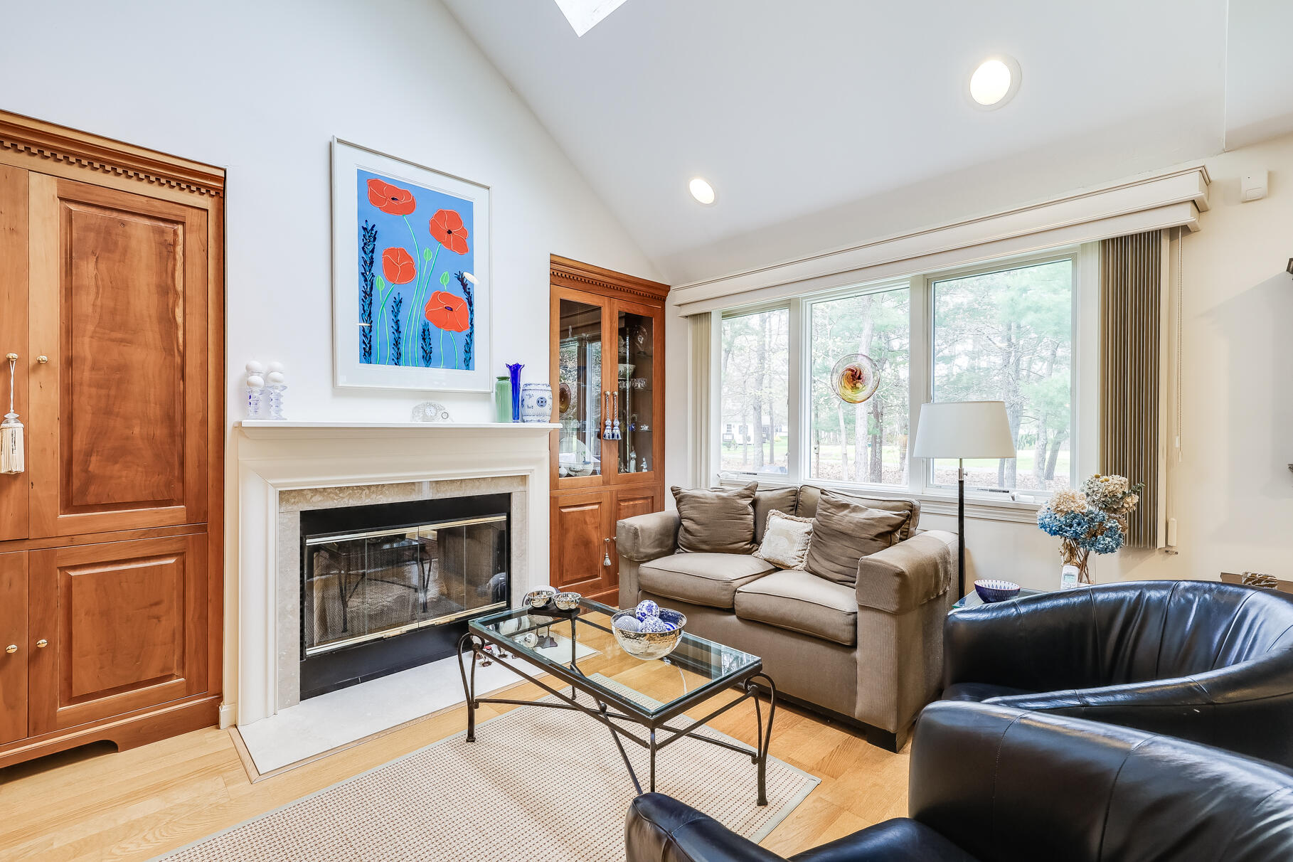 23 Longwood Road Mashpee, MA 02649 - Photo 13 of 66 a living room with furniture a fireplace and a large window