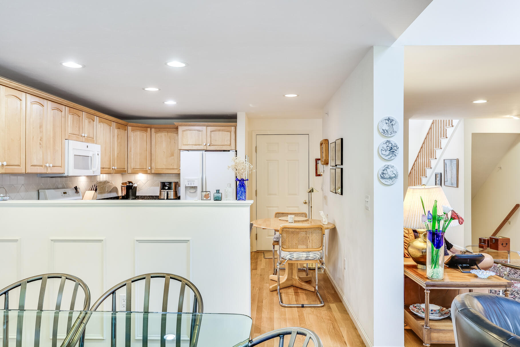 23 Longwood Road Mashpee, MA 02649 - Photo 17 of 66 a kitchen with stainless steel appliances a refrigerator a stove a sink dishwasher with a dining table and chairs