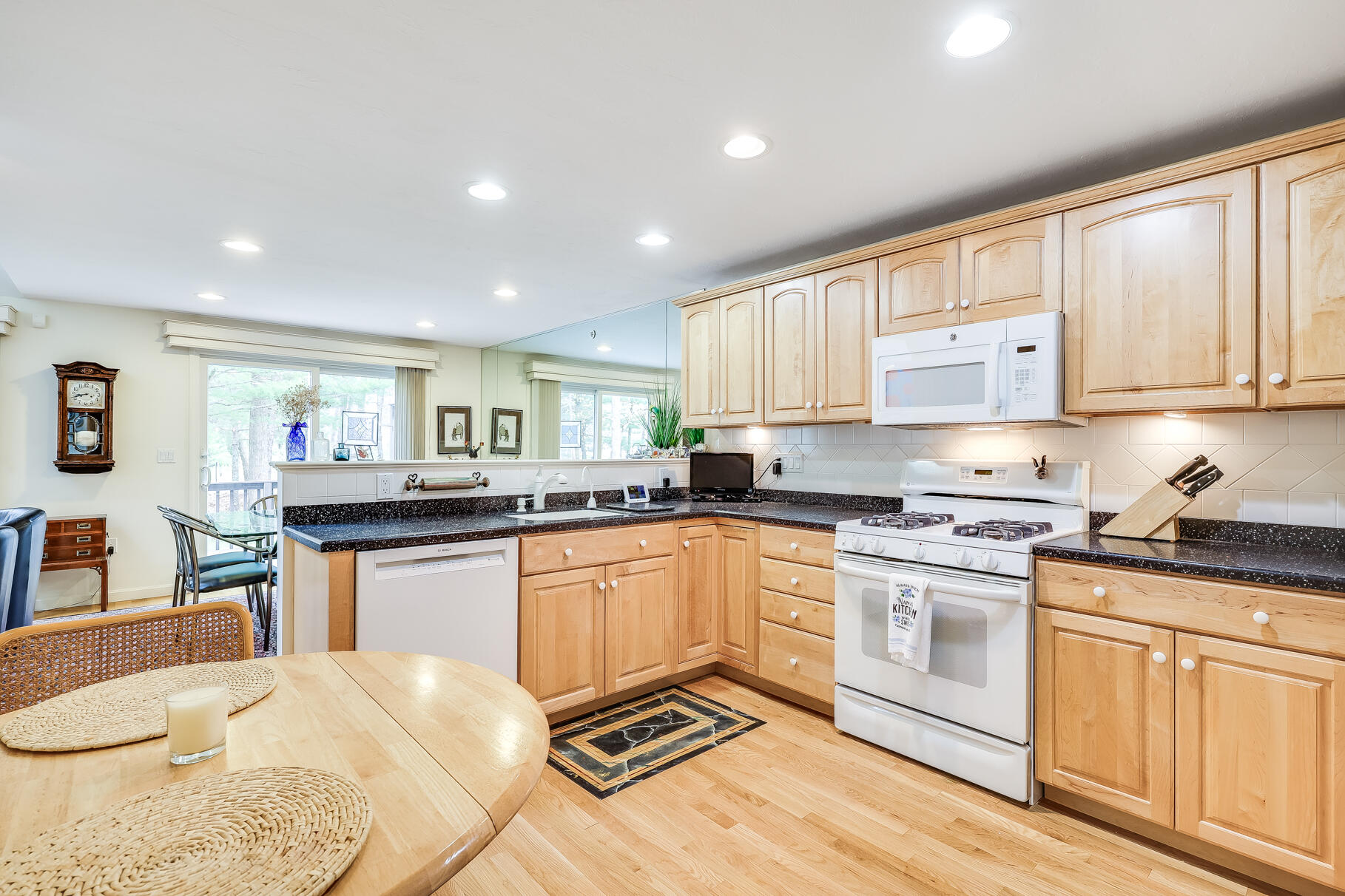 23 Longwood Road Mashpee, MA 02649 - Photo 18 of 66 a kitchen with stainless steel appliances granite countertop a stove sink and cabinets