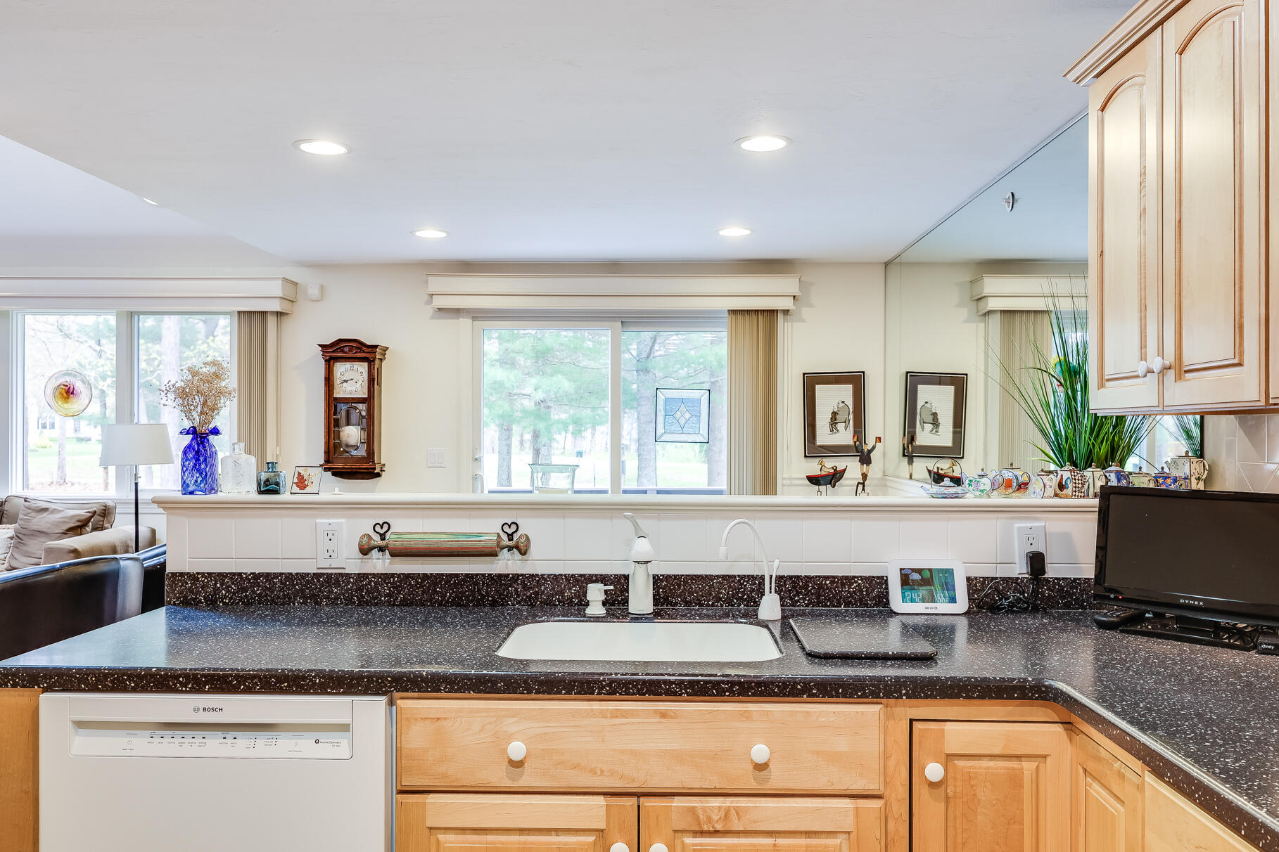 23 Longwood Road Mashpee, MA 02649 - Photo 19 of 66 a kitchen with granite countertop a sink and a granite counter tops