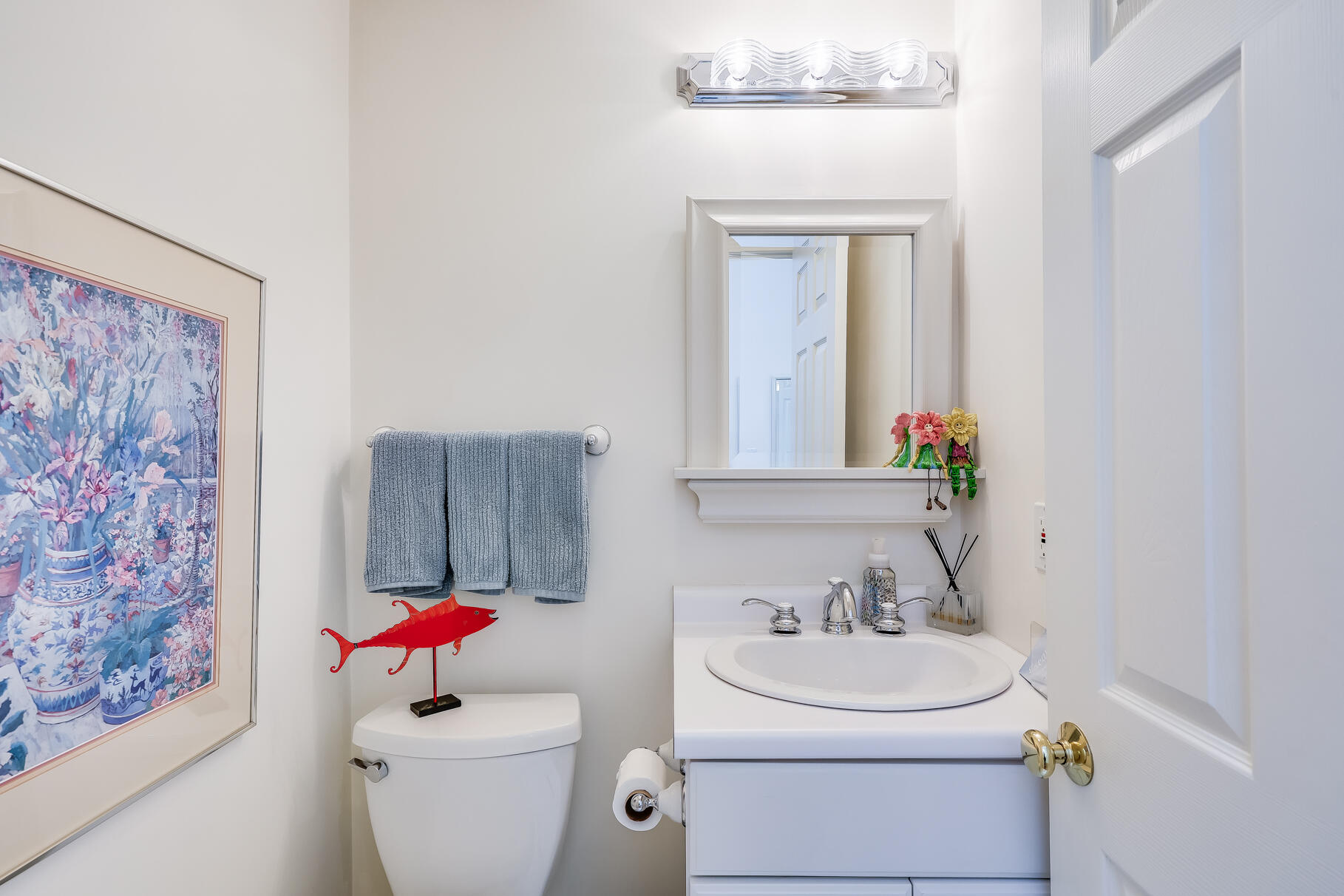 23 Longwood Road Mashpee, MA 02649 - Photo 25 of 66 a bathroom with a toilet sink and mirror
