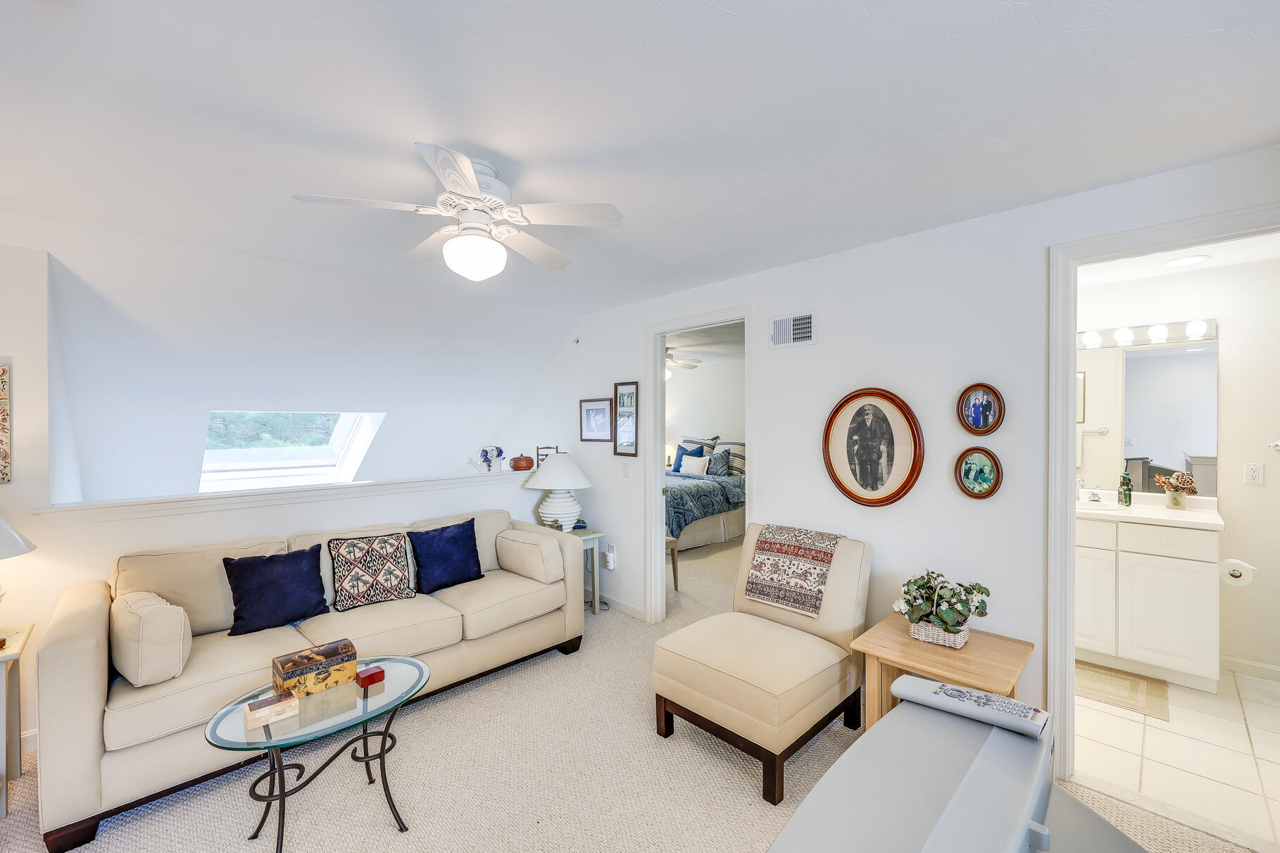 23 Longwood Road Mashpee, MA 02649 - Photo 32 of 66 a living room with furniture and a clock