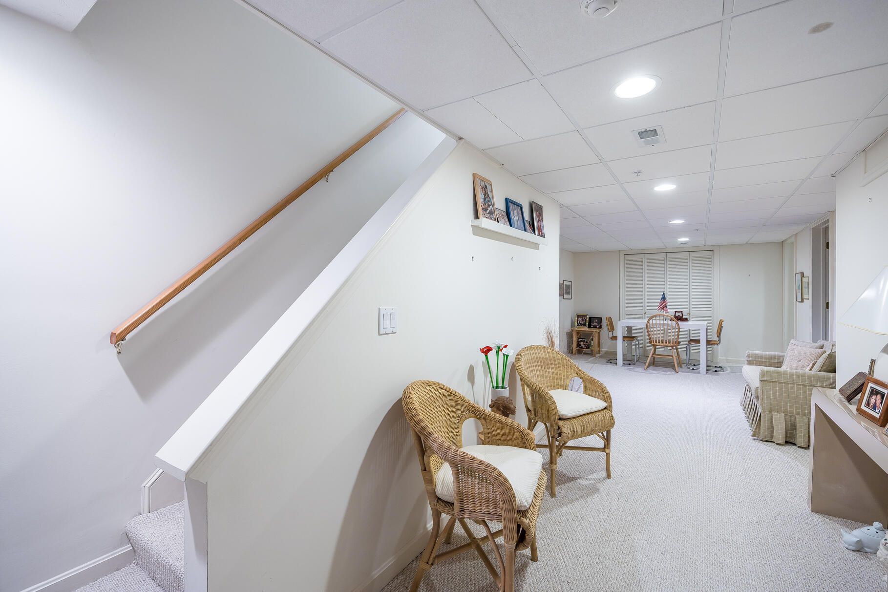 23 Longwood Road Mashpee, MA 02649 - Photo 40 of 66 a living room with furniture and a chandelier