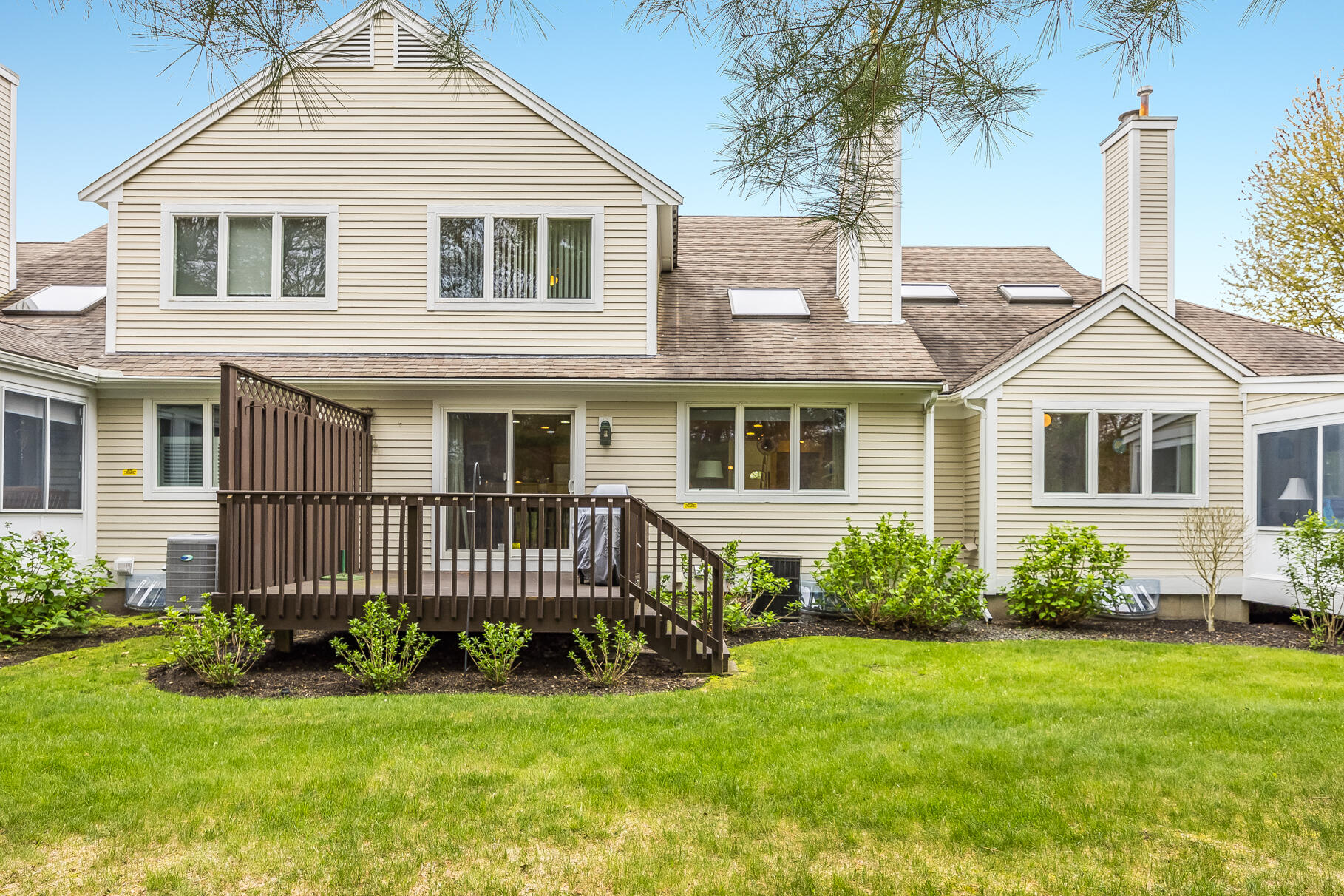 23 Longwood Road Mashpee, MA 02649 - Photo 9 of 66 a front view of a house with a yard
