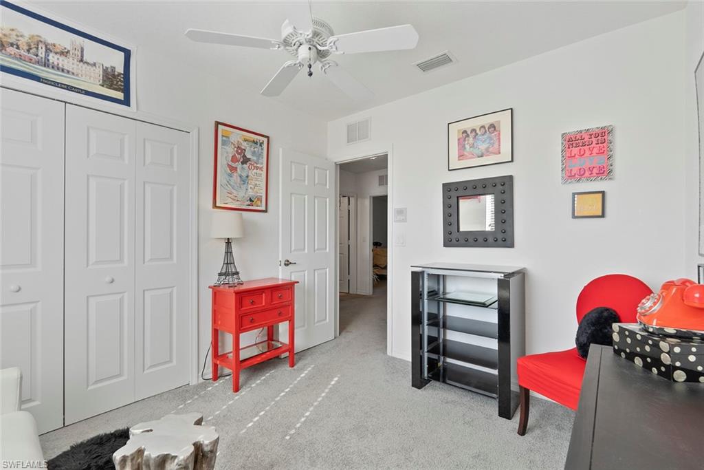 9838 Roundstone Circle Fort Myers, FL 33967 - Photo 12 of 25 a living room with furniture and a lamp