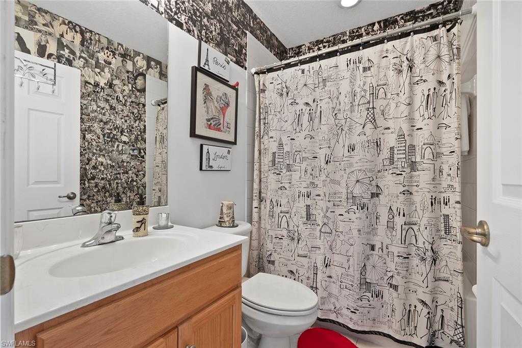 9838 Roundstone Circle Fort Myers, FL 33967 - Photo 14 of 25 a bathroom with a sink toilet and shower