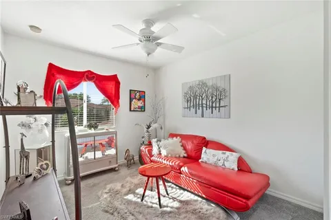 a living room with furniture and a rug