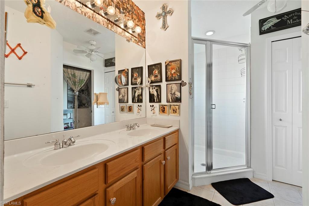 9838 Roundstone Circle Fort Myers, FL 33967 - Photo 19 of 25 a bathroom with a sink and a mirror