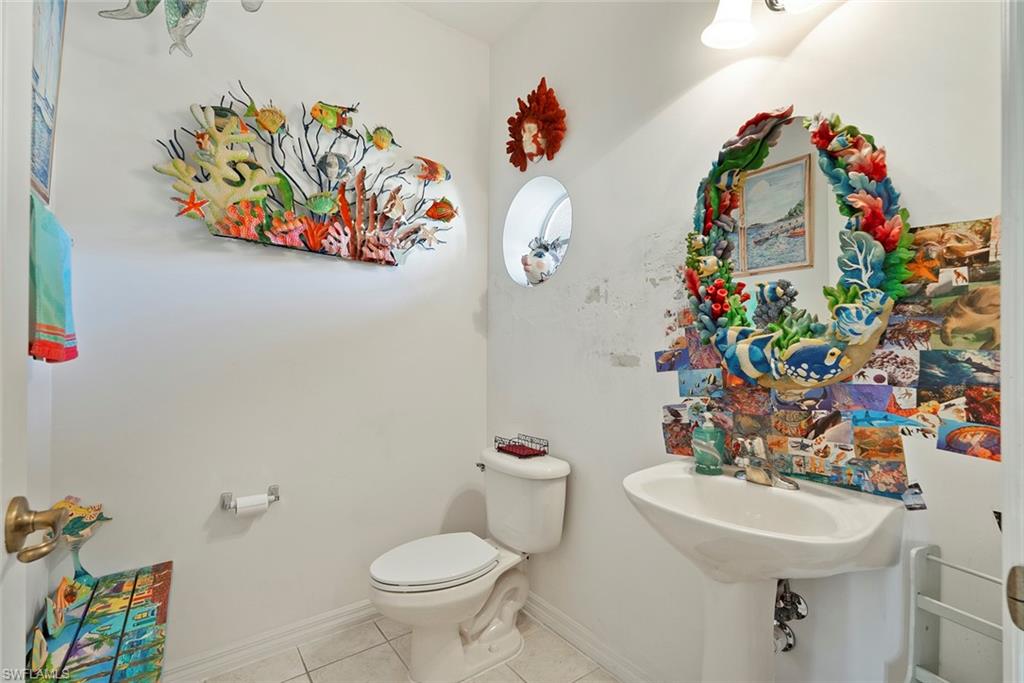 9838 Roundstone Circle Fort Myers, FL 33967 - Photo 20 of 25 a bathroom with a sink mirror and toilet