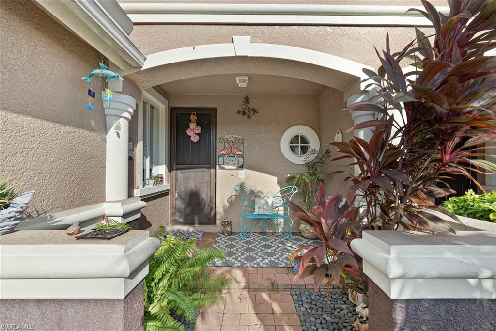 9838 Roundstone Circle Fort Myers, FL 33967 - Photo 2 of 25 a front view of a house