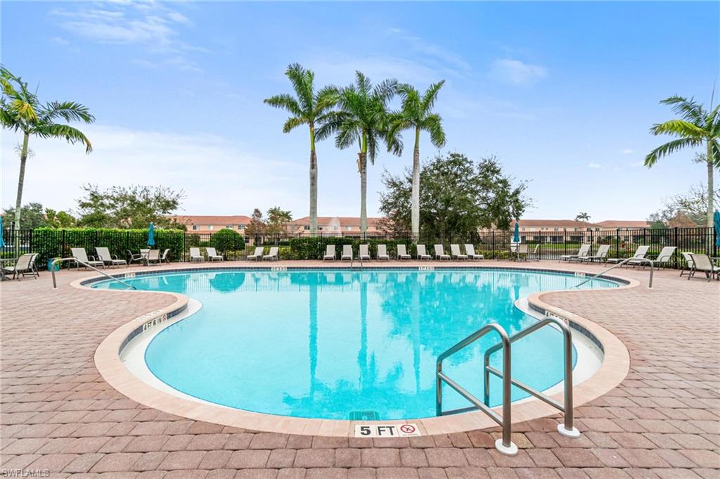9838 Roundstone Circle Fort Myers, FL 33967 - Photo 23 of 25 a view of a swimming pool and lounge chair