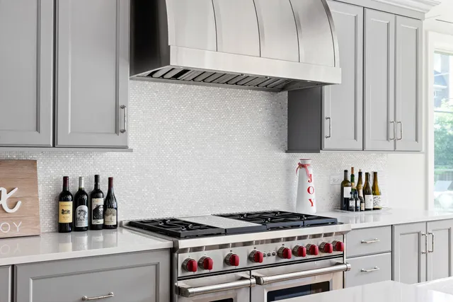 a living room with furniture a fireplace and a large window