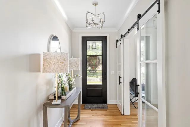 a kitchen with cabinets appliances and a window