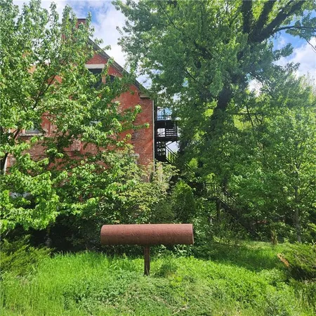 a view of a house in a forest