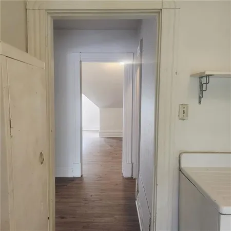a view of a bathroom from the hallway