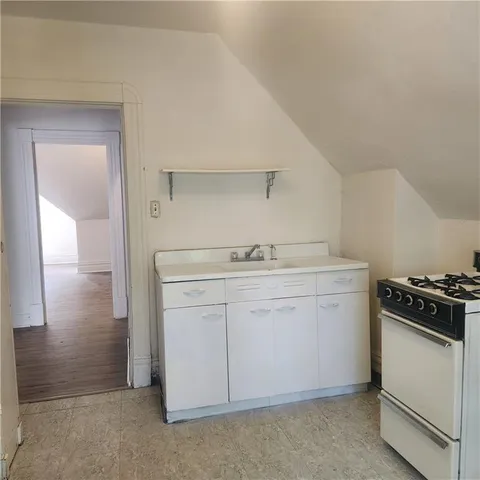 a utility room with sink dryer and washer
