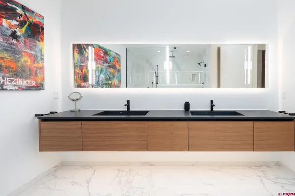 a spacious bathroom with a bathtub and a sink