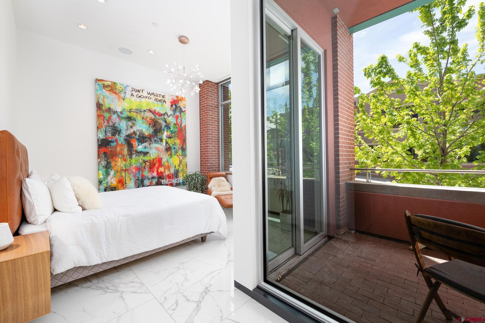 1201 Main Avenue, Unit 105 Durango, CO 81301 - Photo 14 of 45 a bedroom with a bed and a window