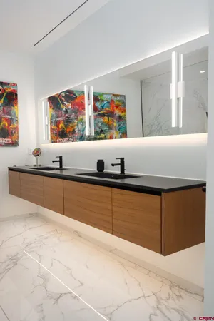a view of kitchen cabinets and window