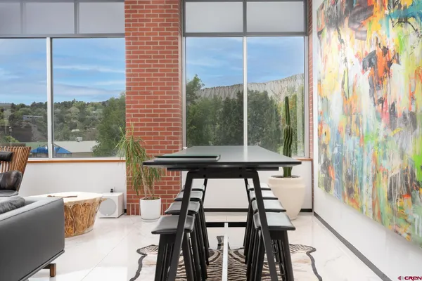 a view of a room with a furniture and floor to ceiling window
