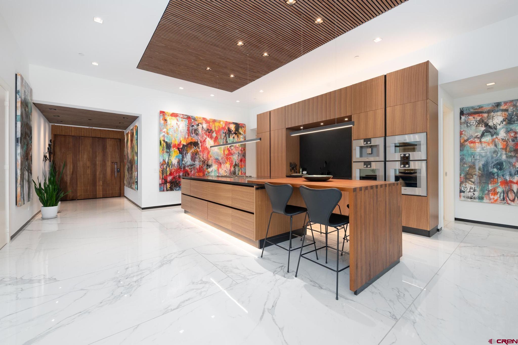 1201 Main Avenue, Unit 105 Durango, CO 81301 - Photo 32 of 45 a living room with furniture and a flat screen tv