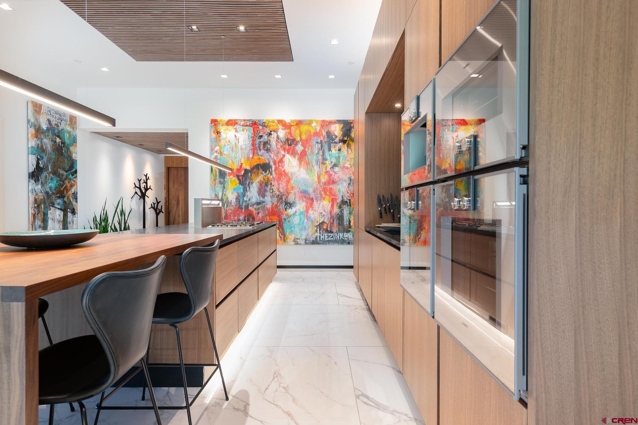 1201 Main Avenue, Unit 105 Durango, CO 81301 - Photo 33 of 45 a hallway with furniture and kitchen view