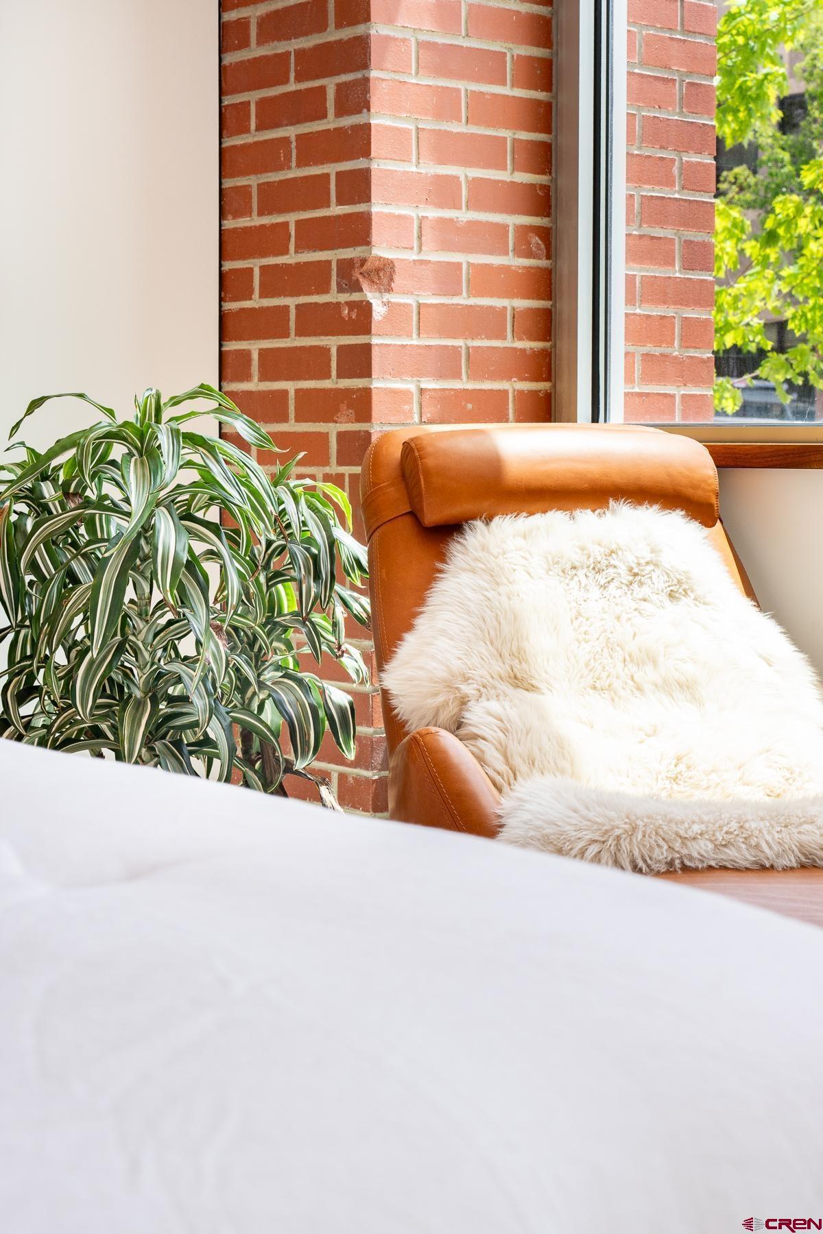 1201 Main Avenue, Unit 105 Durango, CO 81301 - Photo 37 of 45 a potted plant sitting in front of a house
