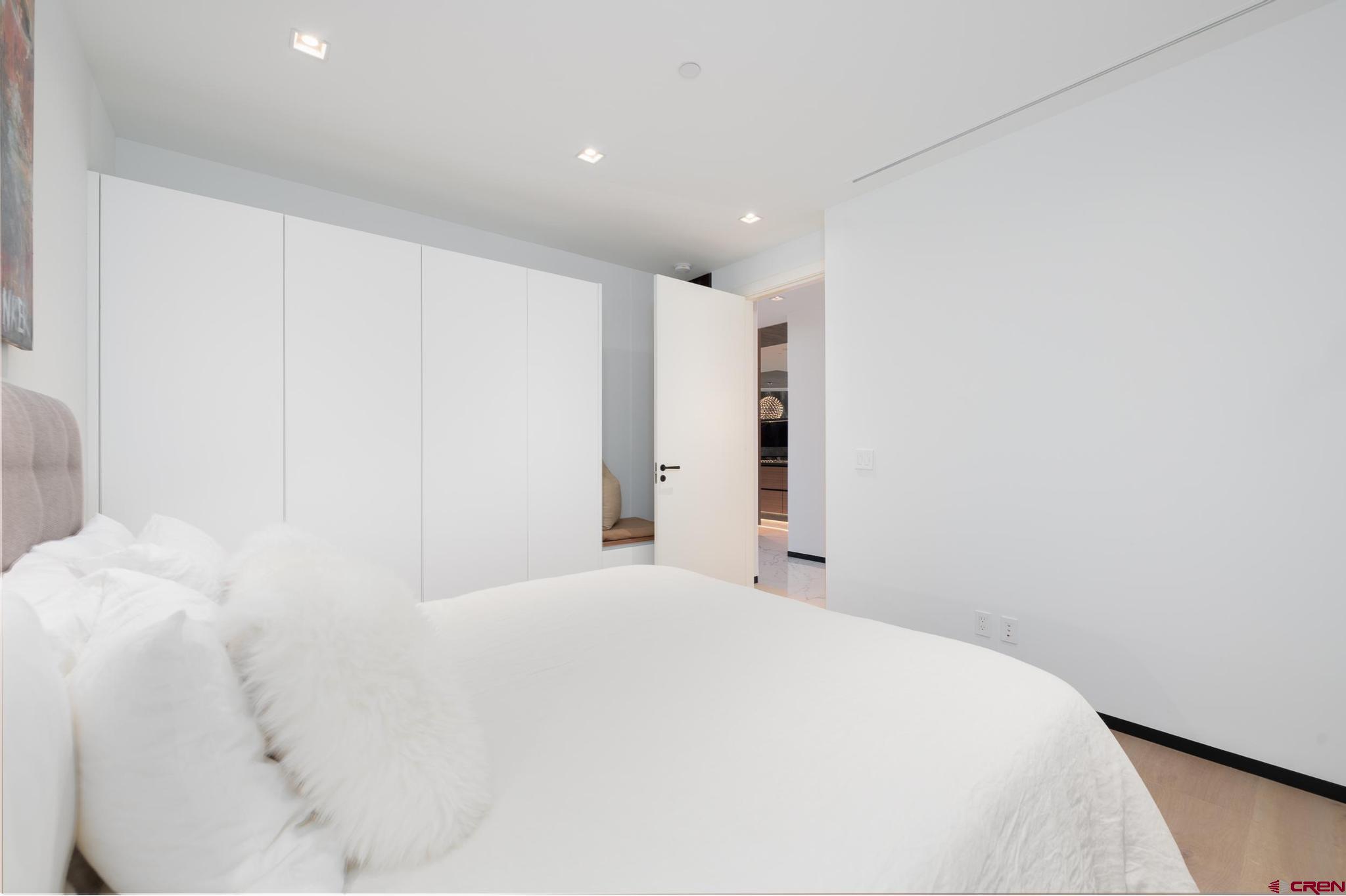 1201 Main Avenue, Unit 105 Durango, CO 81301 - Photo 7 of 45 a large white bed in a white room