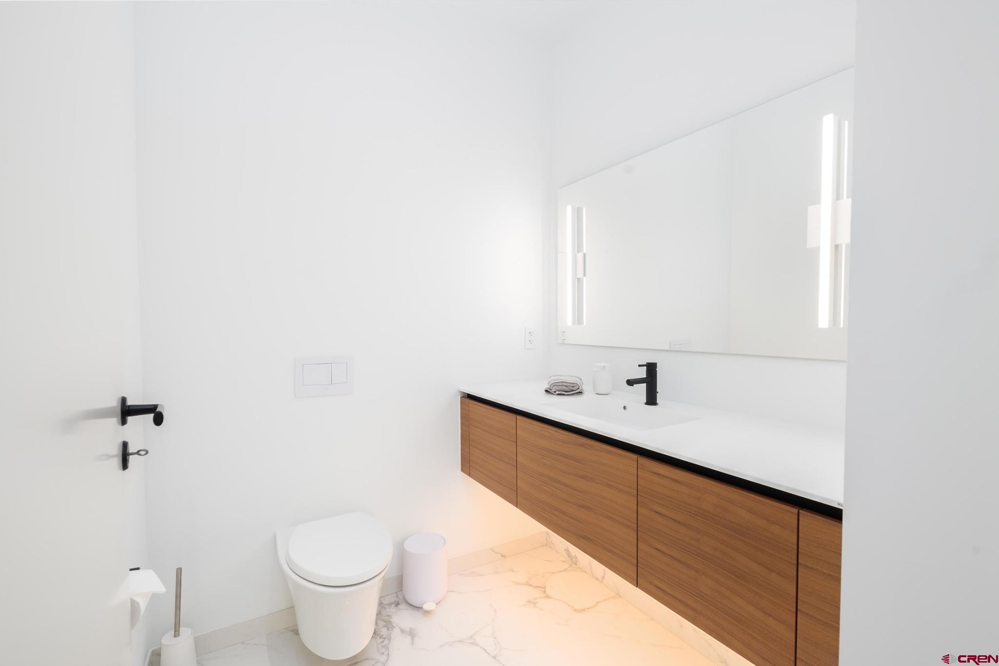 1201 Main Avenue, Unit 105 Durango, CO 81301 - Photo 9 of 45 a bathroom with a sink and a mirror
