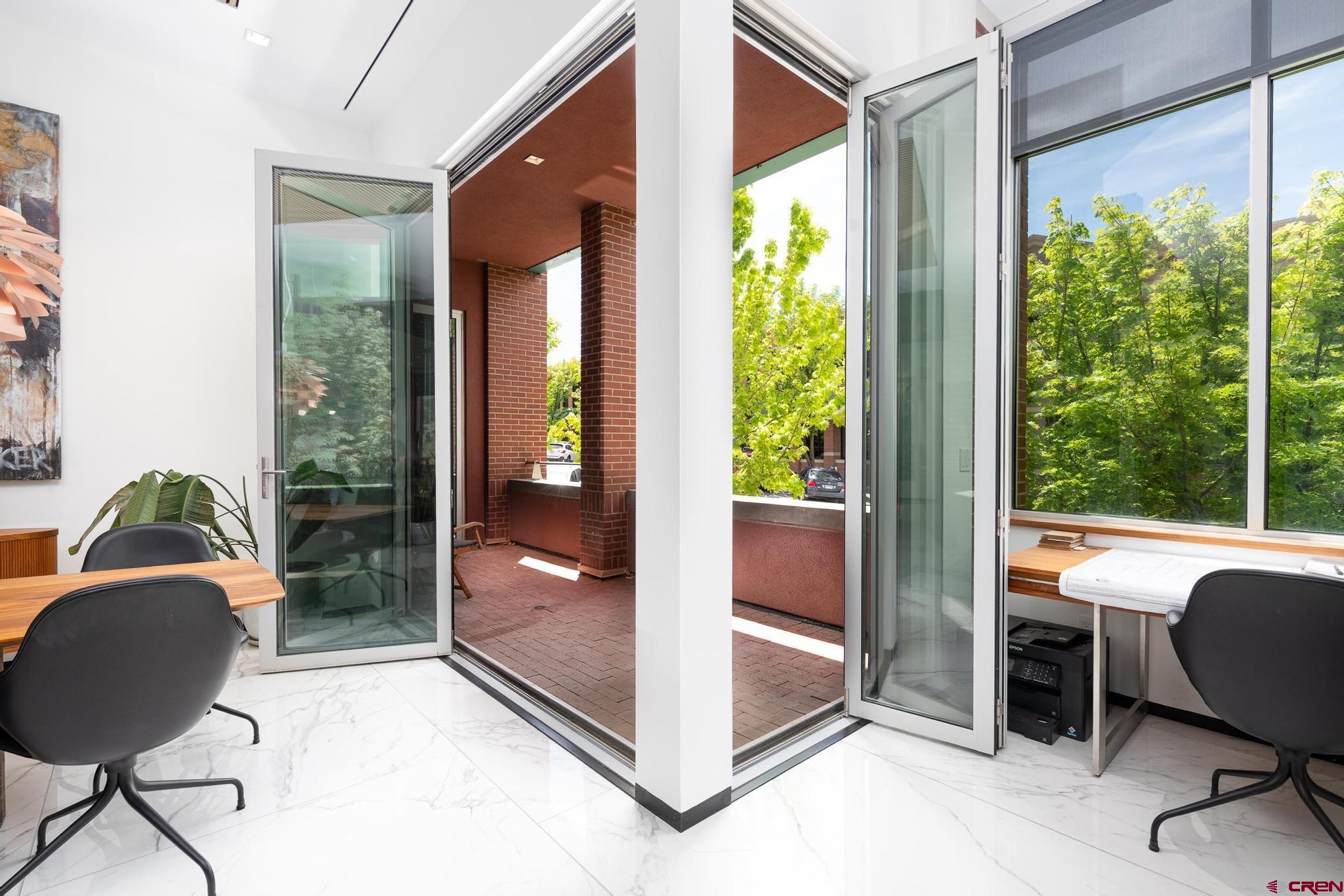 1201 Main Avenue, Unit 105 Durango, CO 81301 - Photo 10 of 45 a view of a workspace with furniture and a window