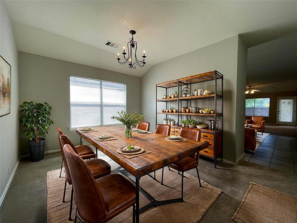 208 Spruce Drive Kyle, TX 78640 - Photo 3 of 26 a view of a dining room with furniture and a window