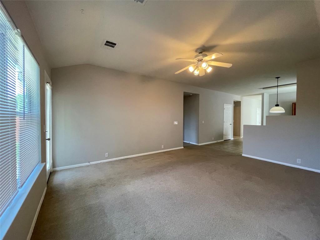 208 Spruce Drive Kyle, TX 78640 - Photo 6 of 26 a view of a livingroom with a ceiling fan and window