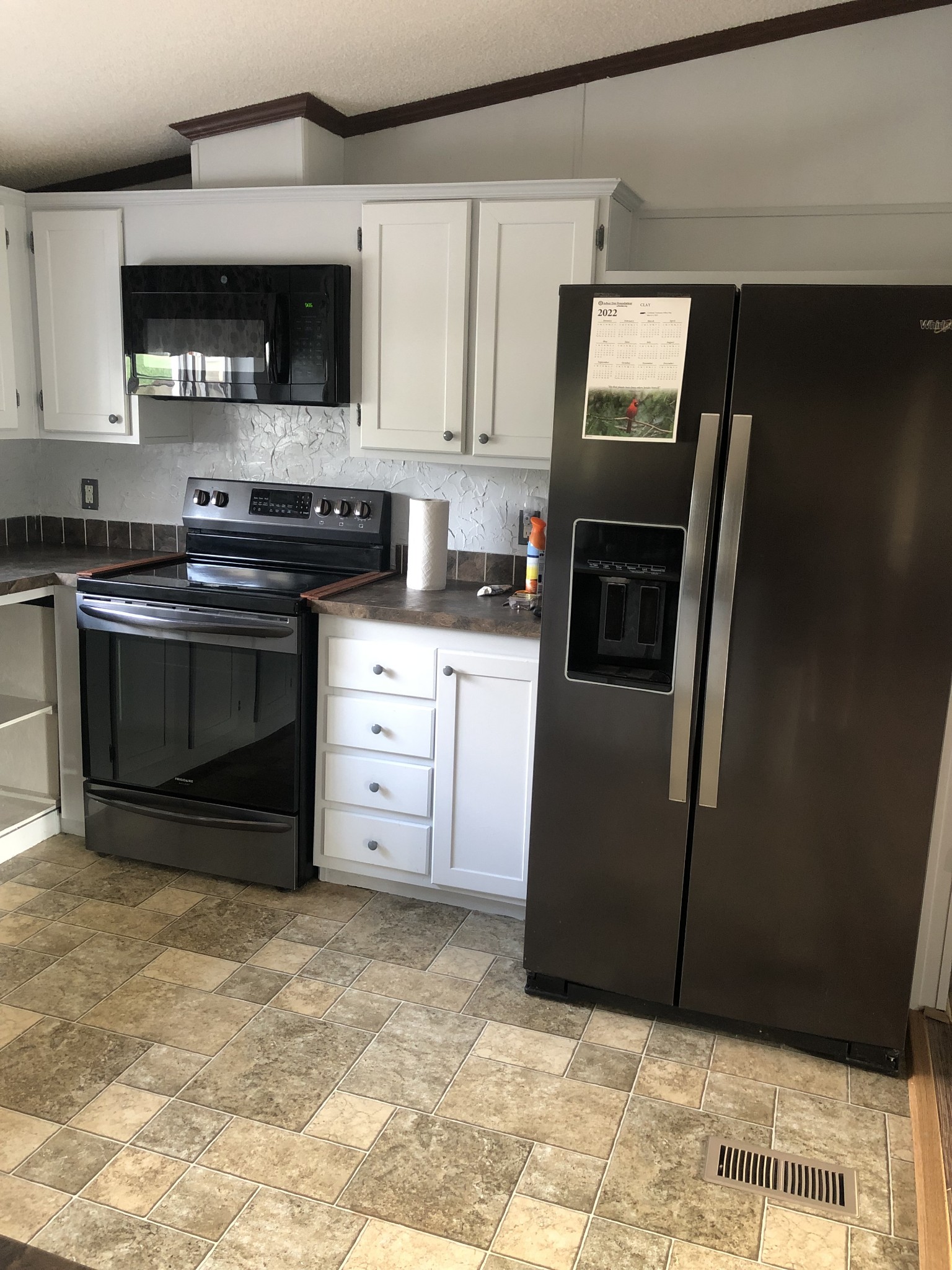 2621 Hagan Road Prospect, TN 38477 - Photo 7 of 18 a kitchen with stainless steel appliances granite countertop a refrigerator stove and microwave