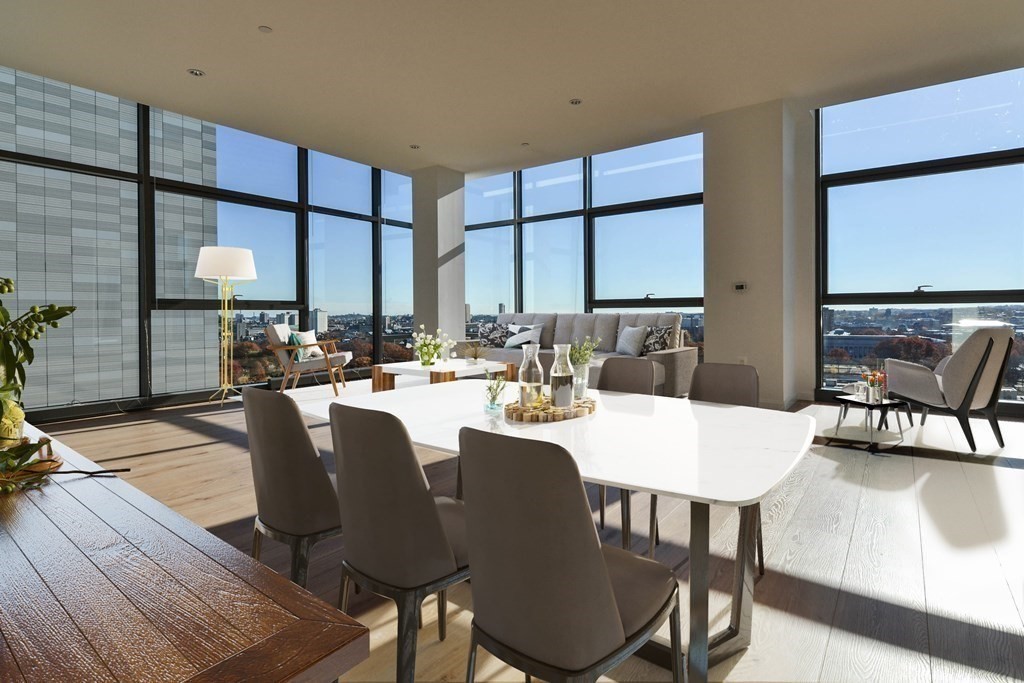 1282 Boylston Street, Unit 1514 Boston, MA 02215 - Photo 2 of 16 a dining room with furniture a large window and a potted plant