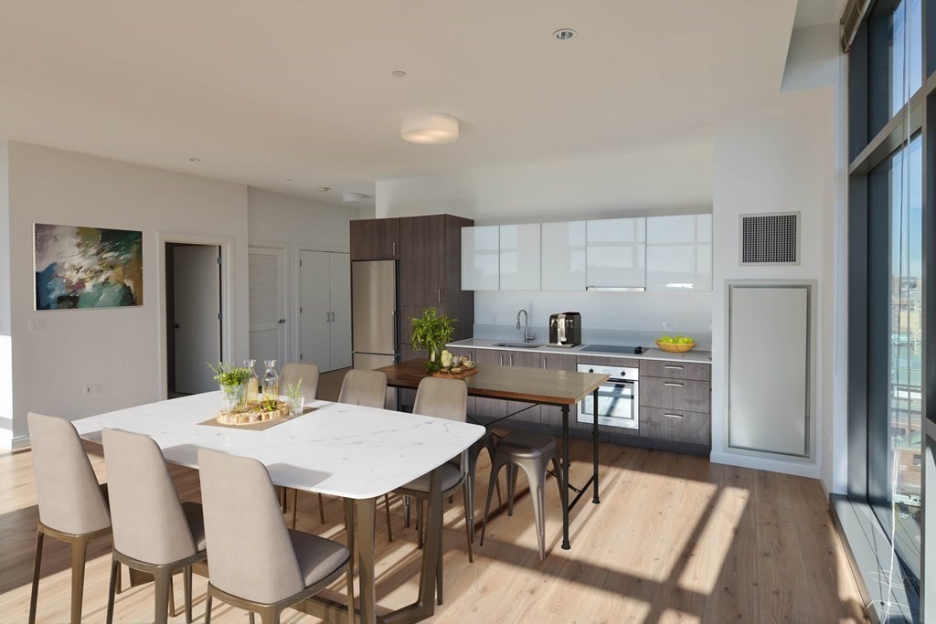 1282 Boylston Street, Unit 1514 Boston, MA 02215 - Photo 5 of 16 a view of a dining room with furniture and wooden floor
