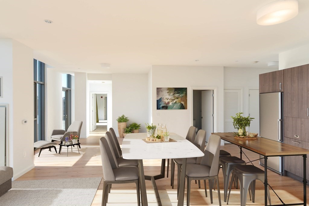 1282 Boylston Street, Unit 1514 Boston, MA 02215 - Photo 6 of 16 a view of a dining room with furniture and a potted plant