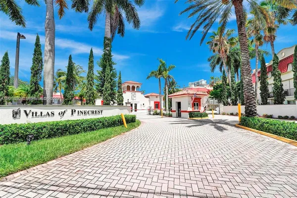 a view of a park with palm trees