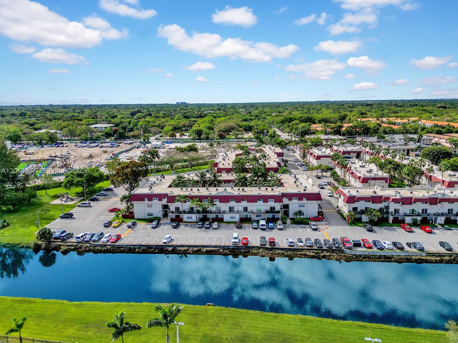 8600 Southwest 67th Avenue, Unit 938 Pinecrest, FL 33156 - Photo 13 of 15 an aerial view of a city with lawn chairs