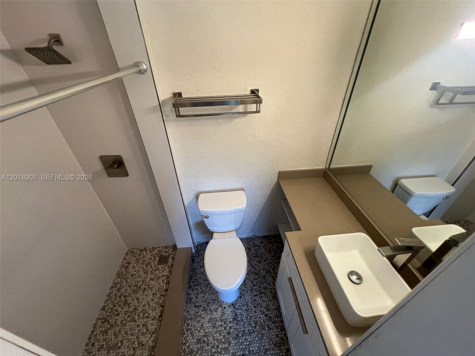 8600 Southwest 67th Avenue, Unit 938 Pinecrest, FL 33156 - Photo 5 of 15 a bathroom with a toilet and a sink
