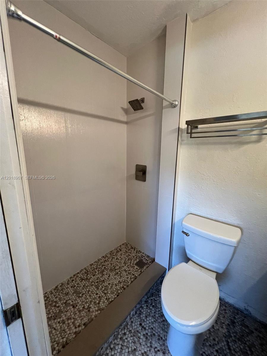 8600 Southwest 67th Avenue, Unit 938 Pinecrest, FL 33156 - Photo 6 of 15 a bathroom with a toilet and a shower