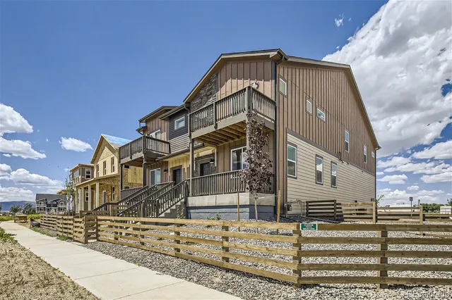 a view of a house with a small yard