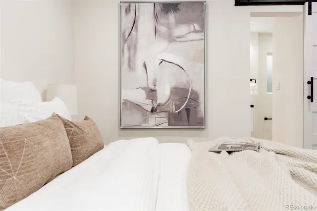 a bedroom with a bed and a couch