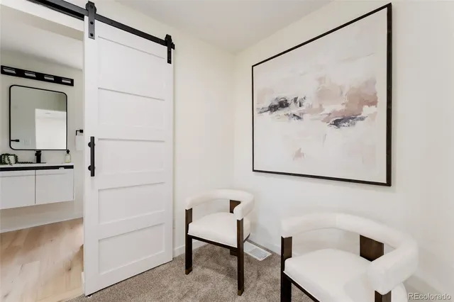 a bathroom with a shower and a sink