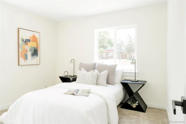 a bedroom with a bed and window